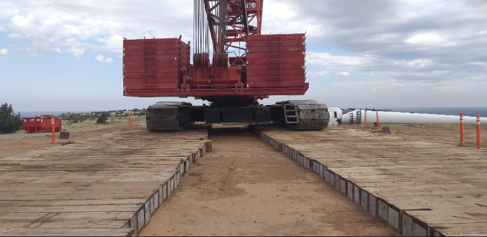 Eucalyptus crane mats providing lift support during wind turbine installation