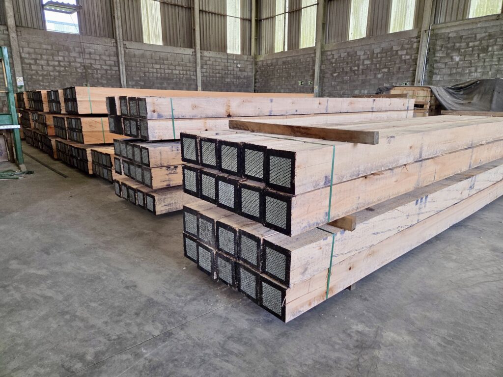 March 2026: Freshly milled Eucalyptus timber mat timbers in warehouse, showing smooth faces and untreated ends before drilling bolt holes